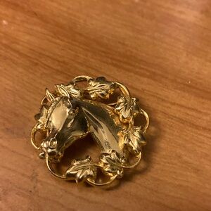 Gold Horse Brooch with Leaf Design